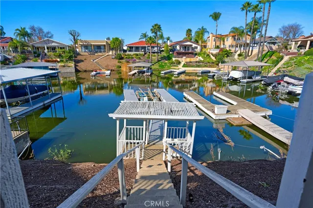 a roof deck with table and chairs