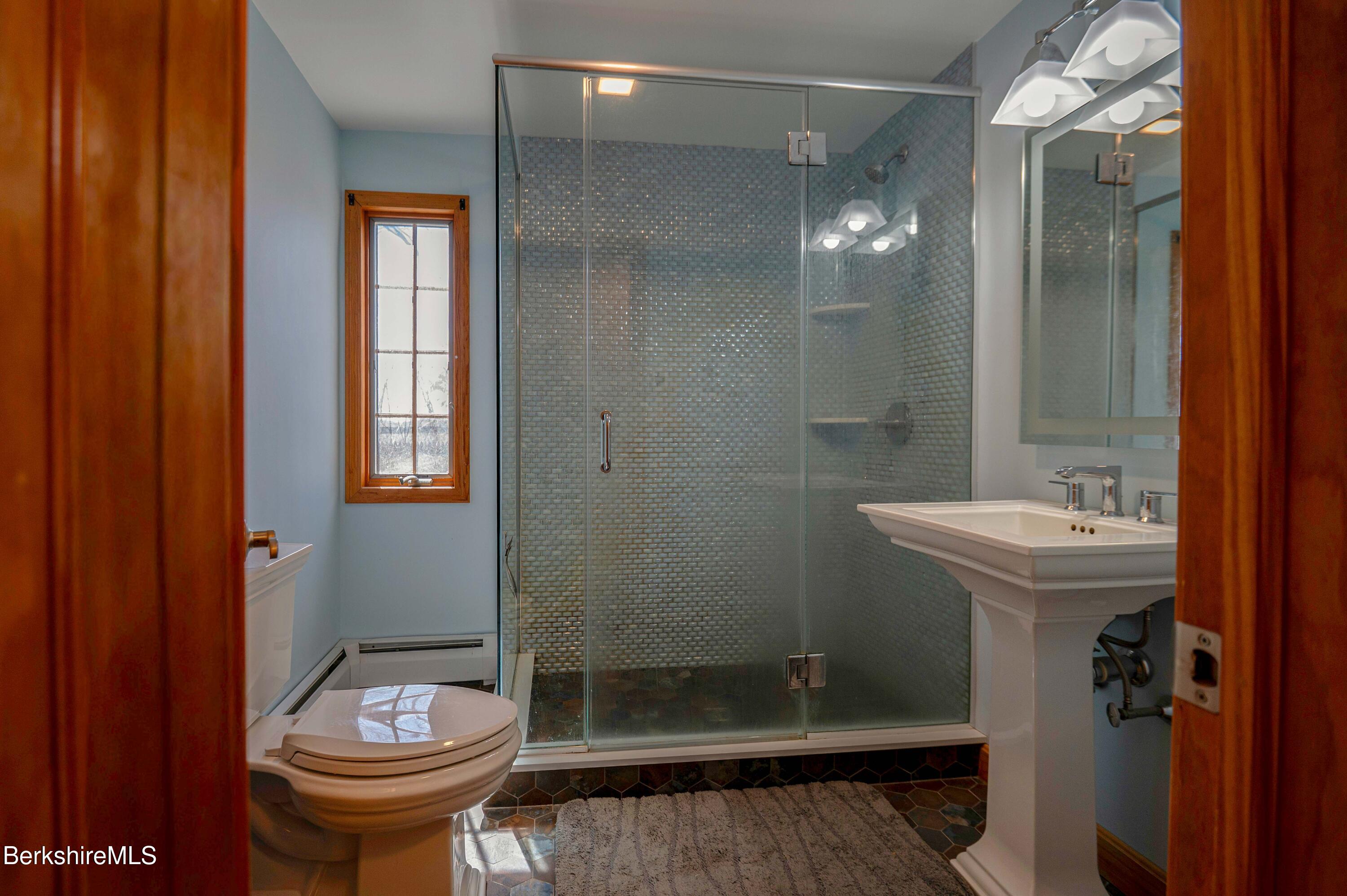 28 Adell Street Pittsfield, MA 01201 - Photo 15 of 26 a bathroom with a sink a toilet and shower