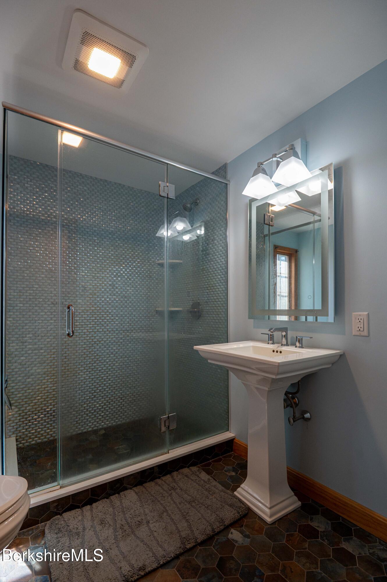 28 Adell Street Pittsfield, MA 01201 - Photo 16 of 26 a bathroom with a sink a toilet and shower