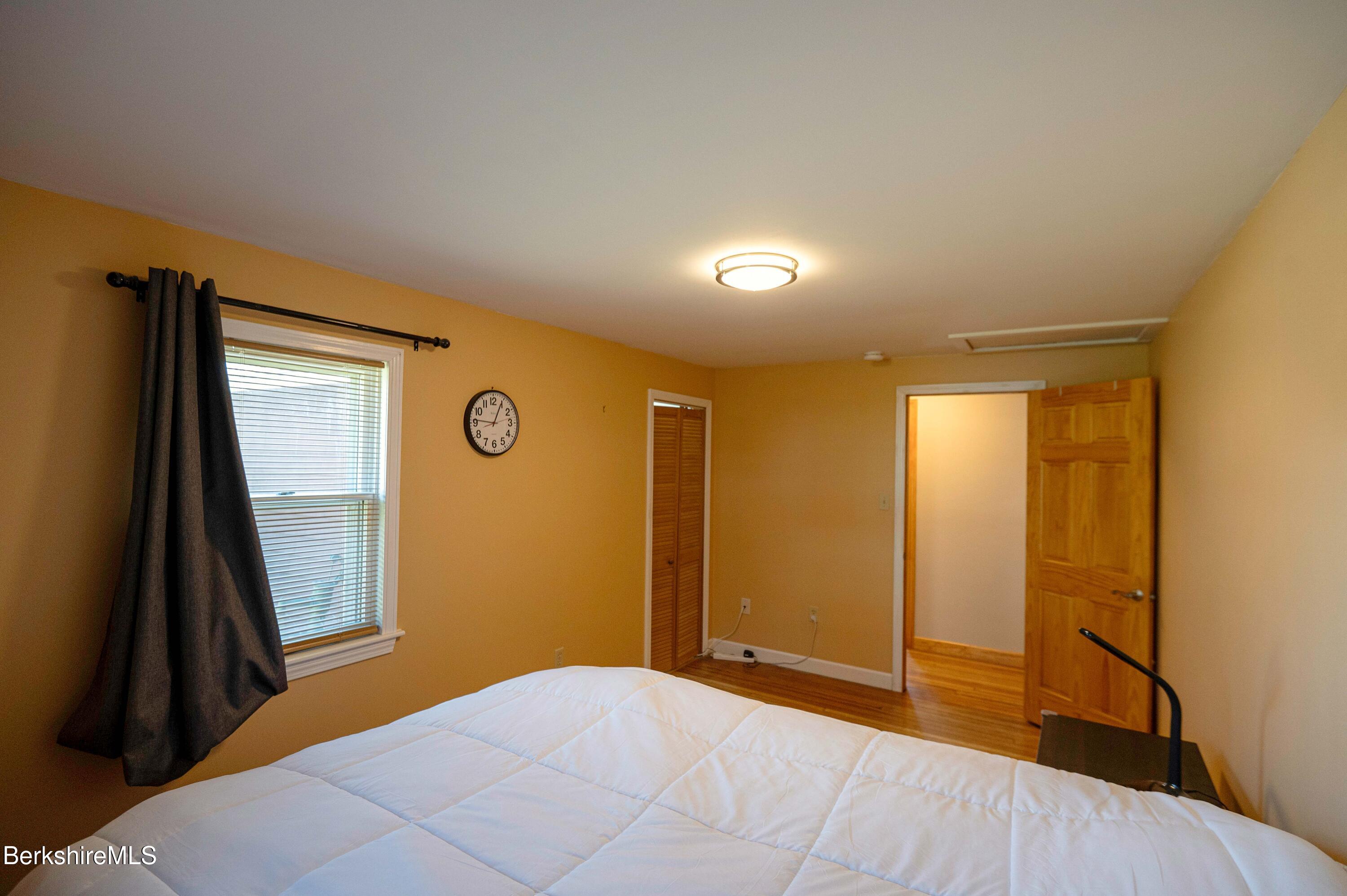 28 Adell Street Pittsfield, MA 01201 - Photo 18 of 26 a view of a livingroom with an empty space and wooden floor