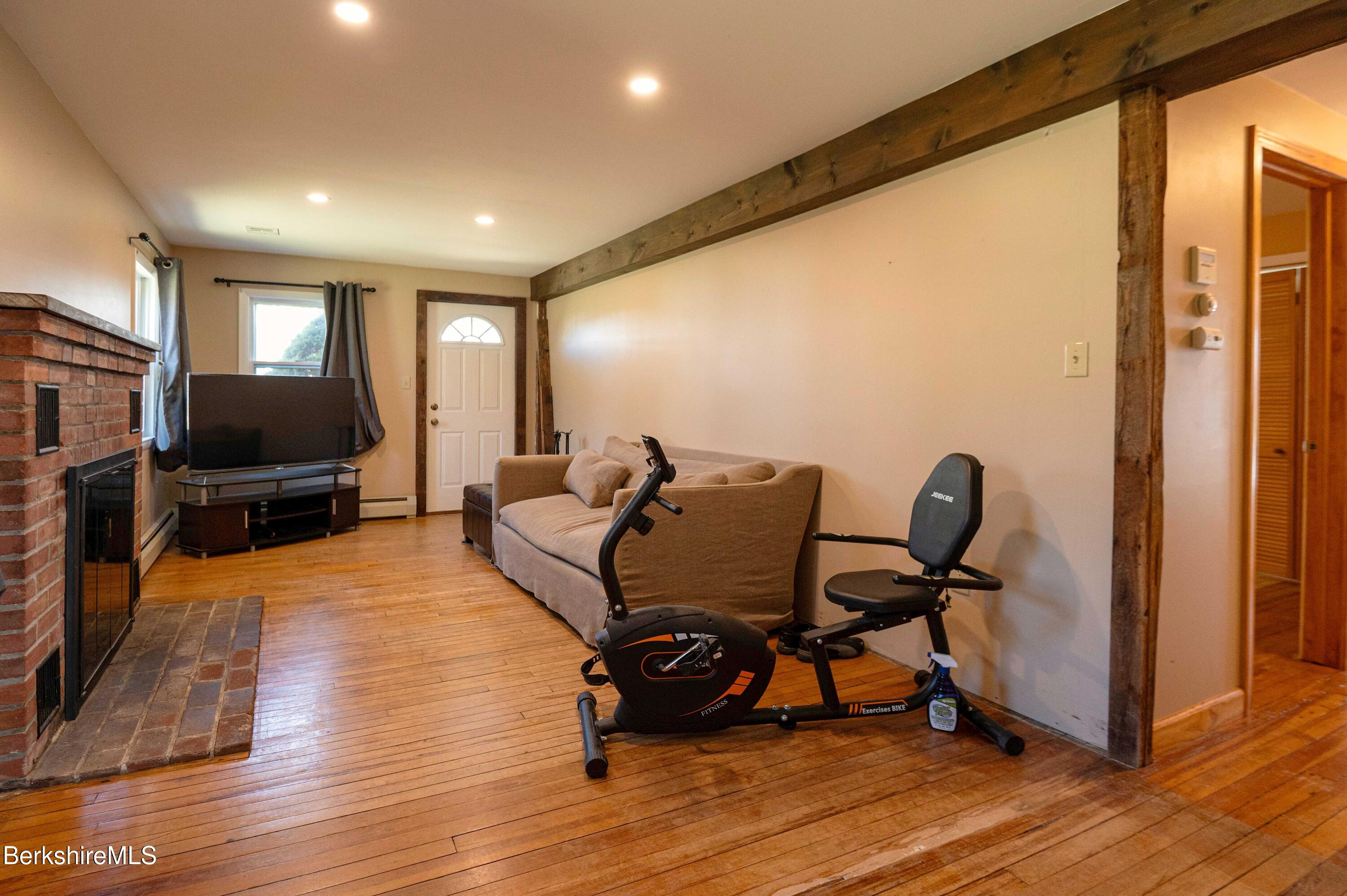 28 Adell Street Pittsfield, MA 01201 - Photo 19 of 26 a living room with furniture and a flat screen tv