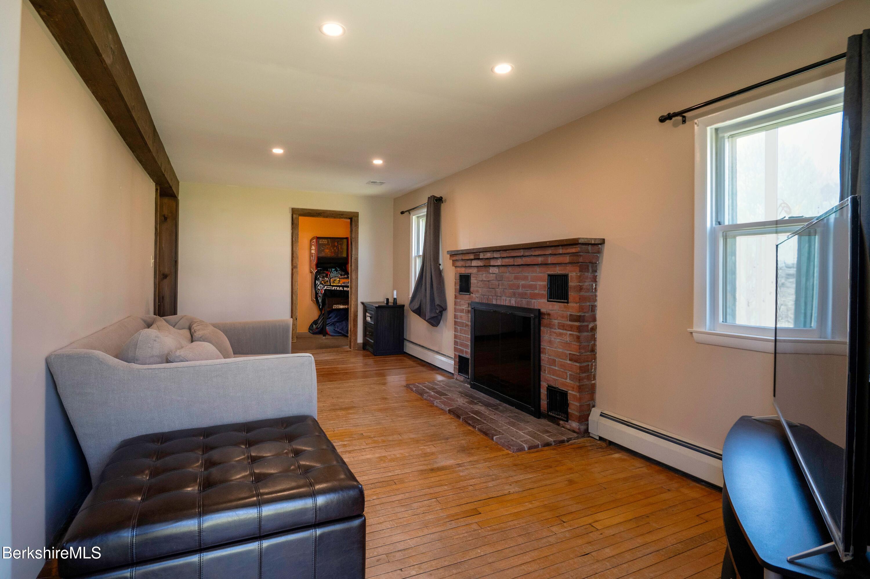 28 Adell Street Pittsfield, MA 01201 - Photo 20 of 26 a living room with furniture and a fireplace