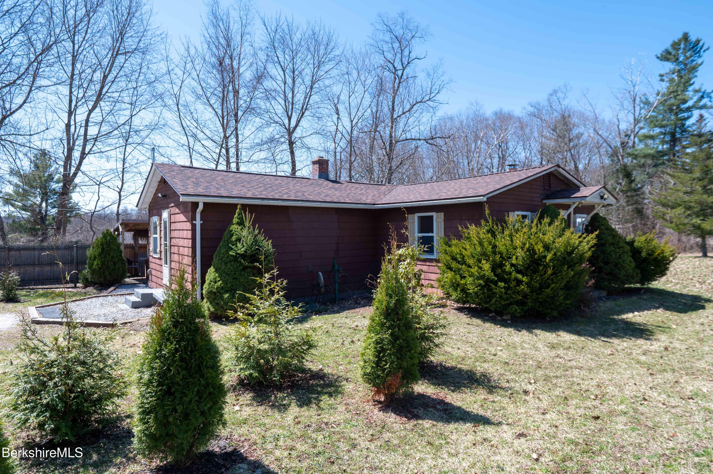 28 Adell Street Pittsfield, MA 01201 - Photo 2 of 26 a view of a house with a flower garden
