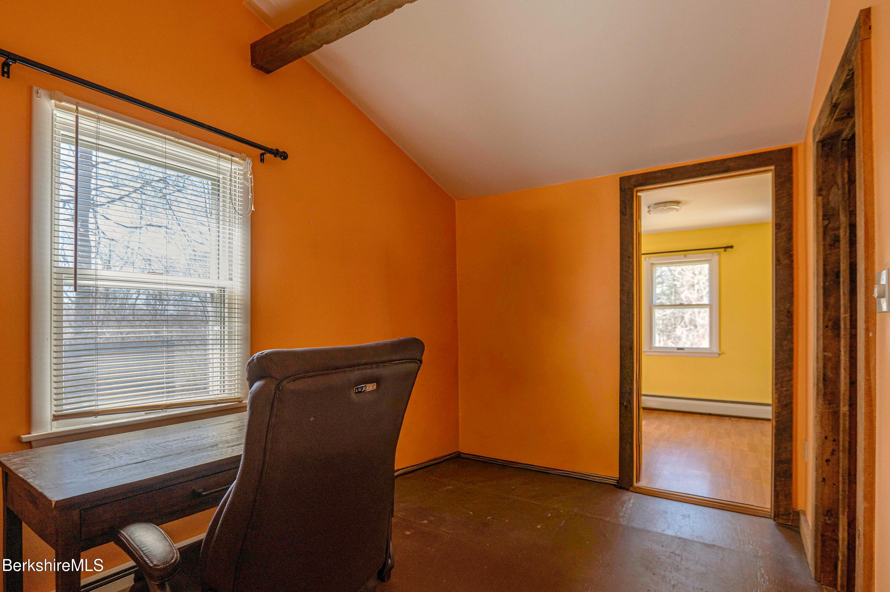 28 Adell Street Pittsfield, MA 01201 - Photo 22 of 26 a view of an empty room with a window and wooden floor