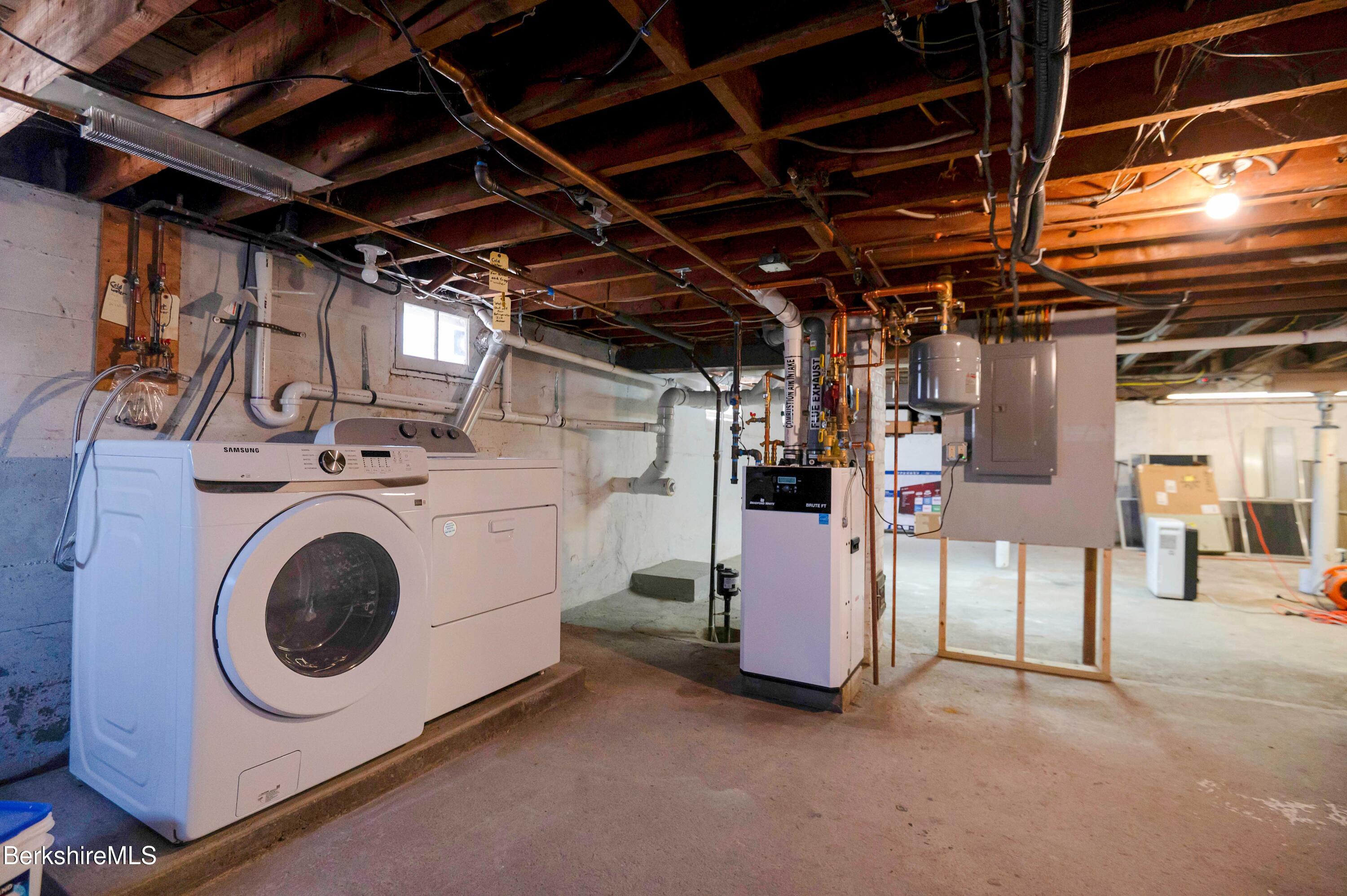 28 Adell Street Pittsfield, MA 01201 - Photo 24 of 26 a utility room with dryer and washer