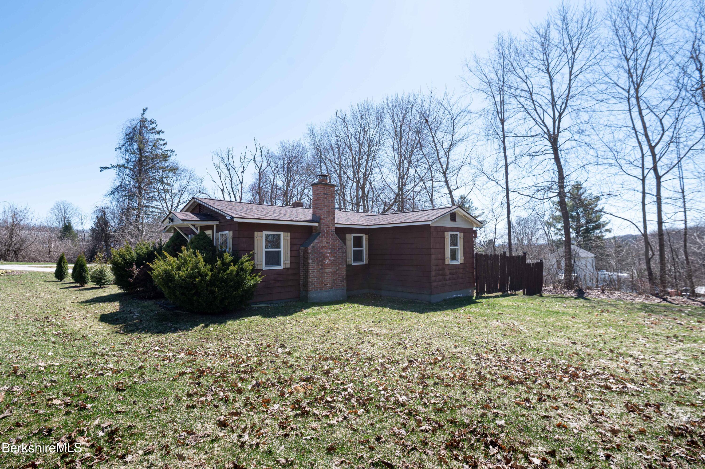 28 Adell Street Pittsfield, MA 01201 - Photo 4 of 26 a view of a house with a yard and trees