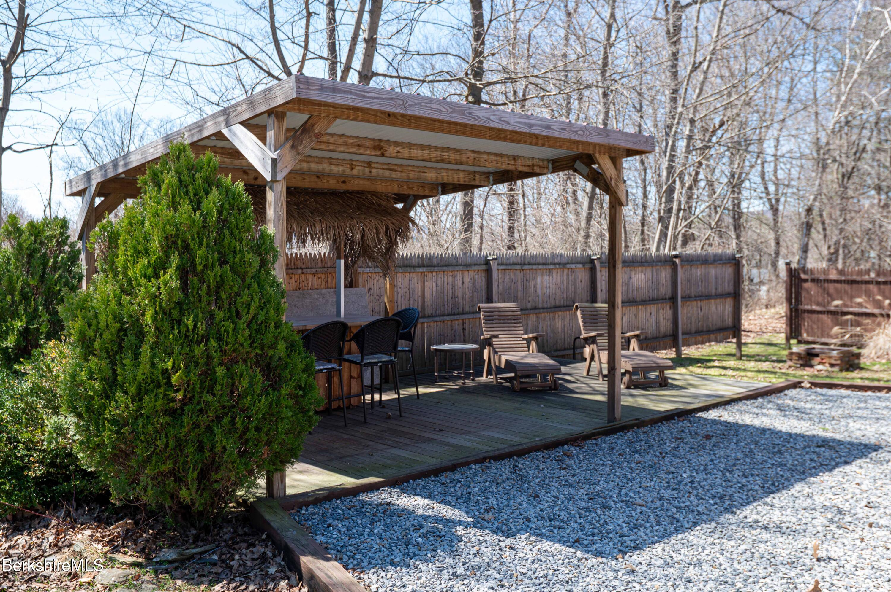 28 Adell Street Pittsfield, MA 01201 - Photo 7 of 26 a view of a chairs and table in the patio