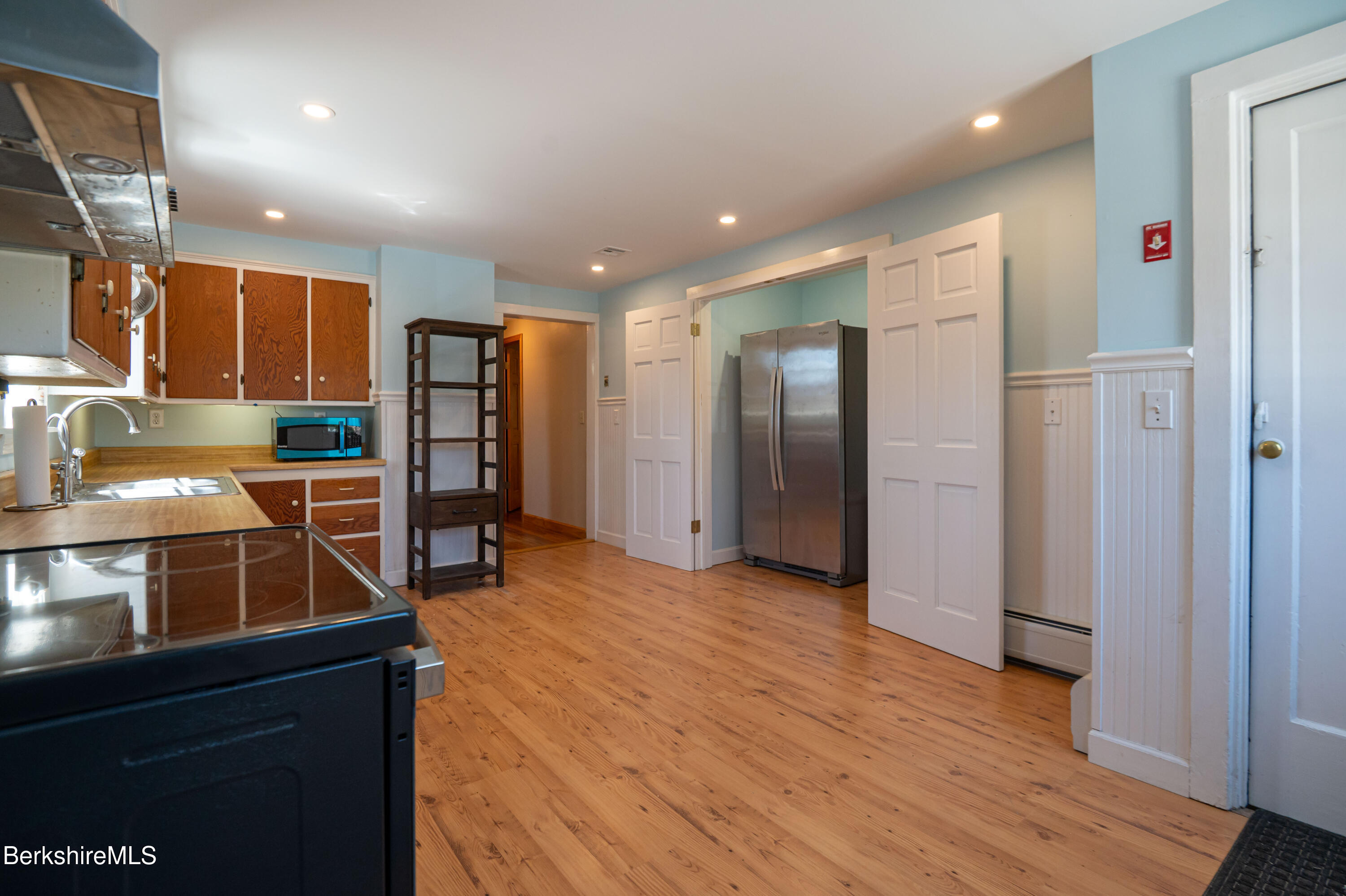 28 Adell Street Pittsfield, MA 01201 - Photo 9 of 26 a open kitchen with stainless steel appliances granite countertop a refrigerator and a sink