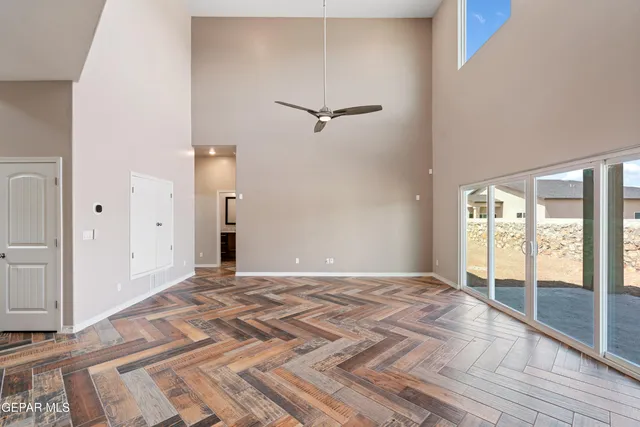a view of a room with a ceiling fan