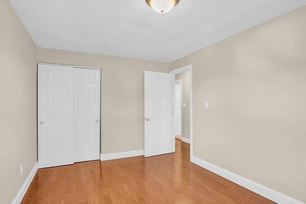 1 Alan Road Hudson, MA 01749 - Photo 19 of 38 a view of an empty room with wooden floor