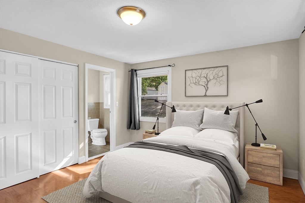 1 Alan Road Hudson, MA 01749 - Photo 21 of 38 a bedroom with a bed and a lamp