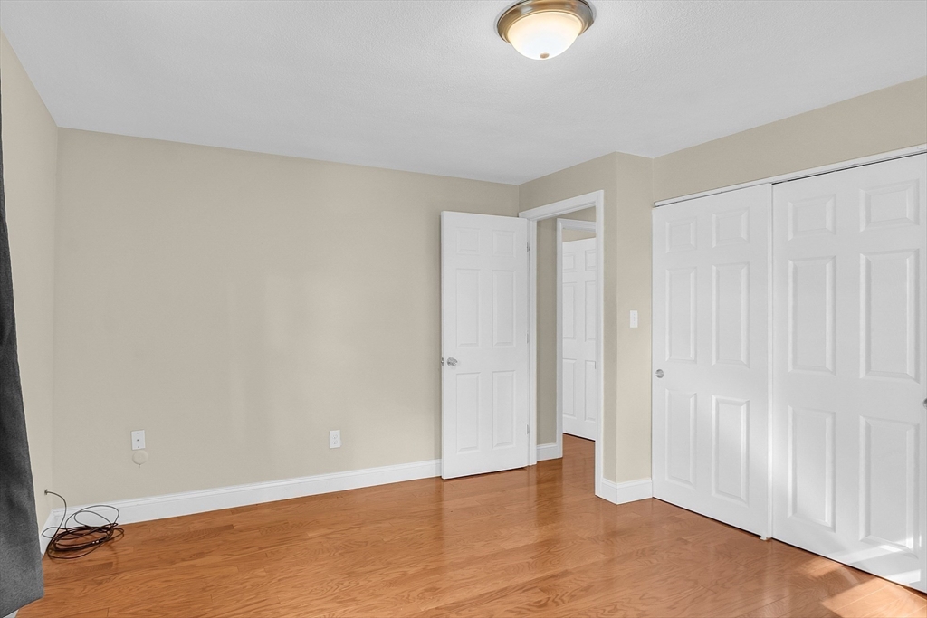 1 Alan Road Hudson, MA 01749 - Photo 24 of 38 a view of an empty room with wooden floor