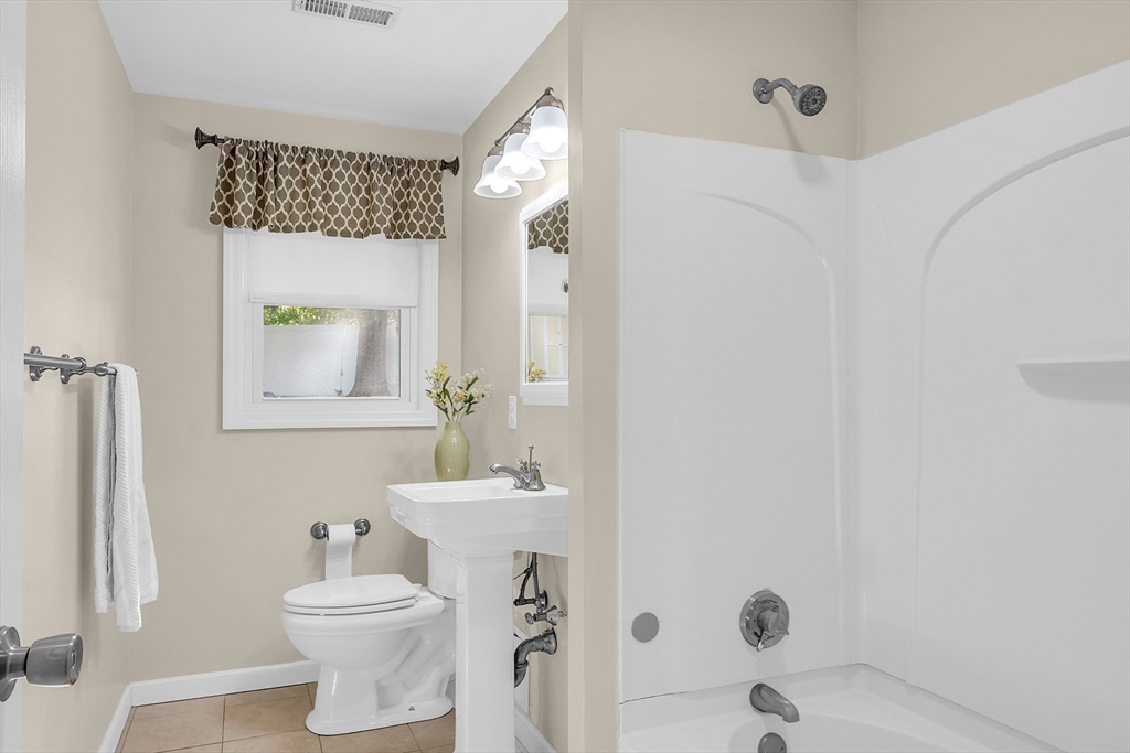 1 Alan Road Hudson, MA 01749 - Photo 26 of 38 a bathroom with a sink toilet and shower