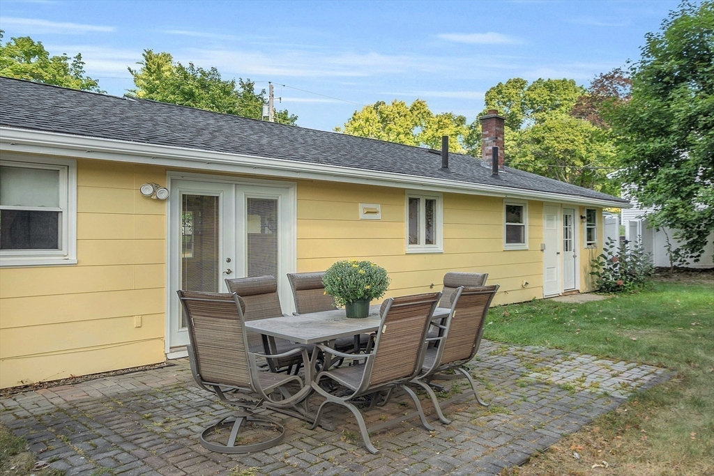 1 Alan Road Hudson, MA 01749 - Photo 37 of 38 a view of a patio with table and chairs and potted plants