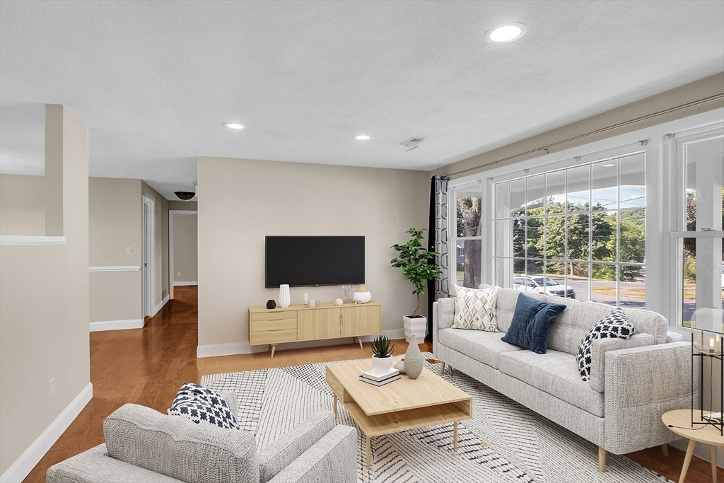 1 Alan Road Hudson, MA 01749 - Photo 7 of 38 a living room with furniture and a flat screen tv