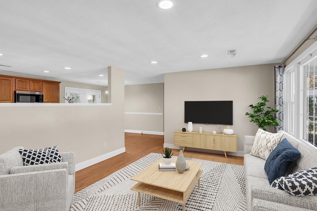 1 Alan Road Hudson, MA 01749 - Photo 8 of 38 a living room with furniture and a flat screen tv