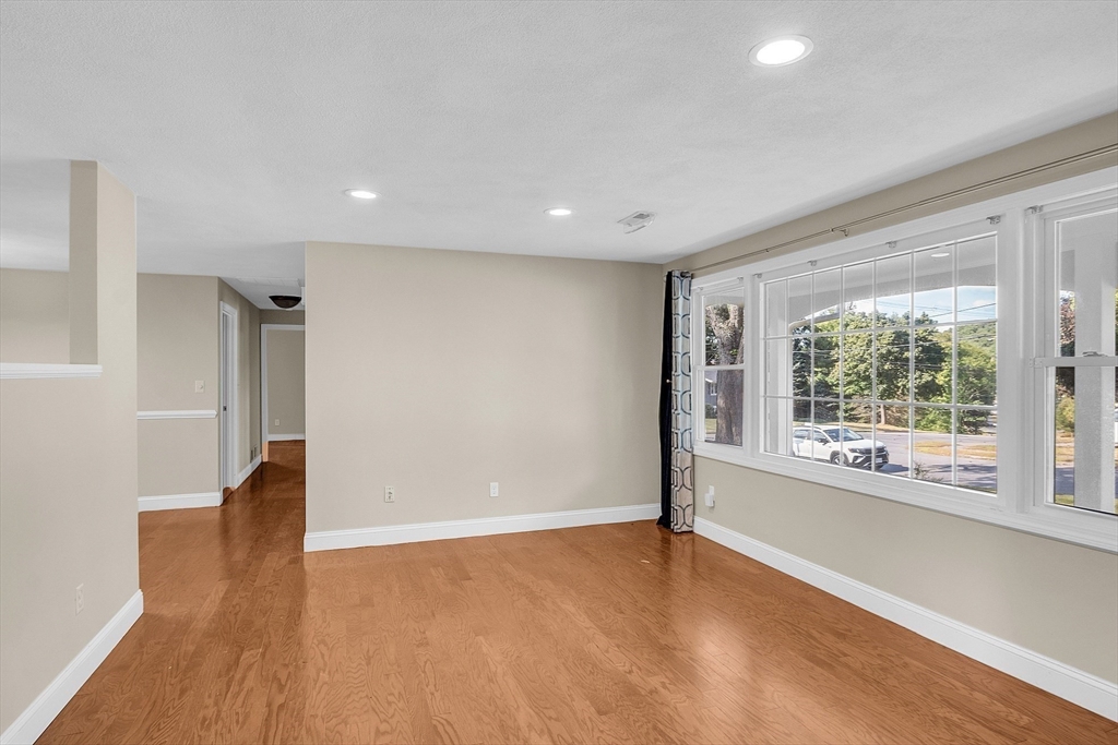 1 Alan Road Hudson, MA 01749 - Photo 9 of 38 wooden floor in an empty room with a window