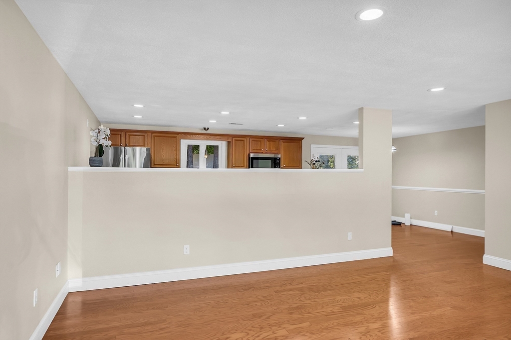 1 Alan Road Hudson, MA 01749 - Photo 10 of 38 an empty room with wooden floor and windows