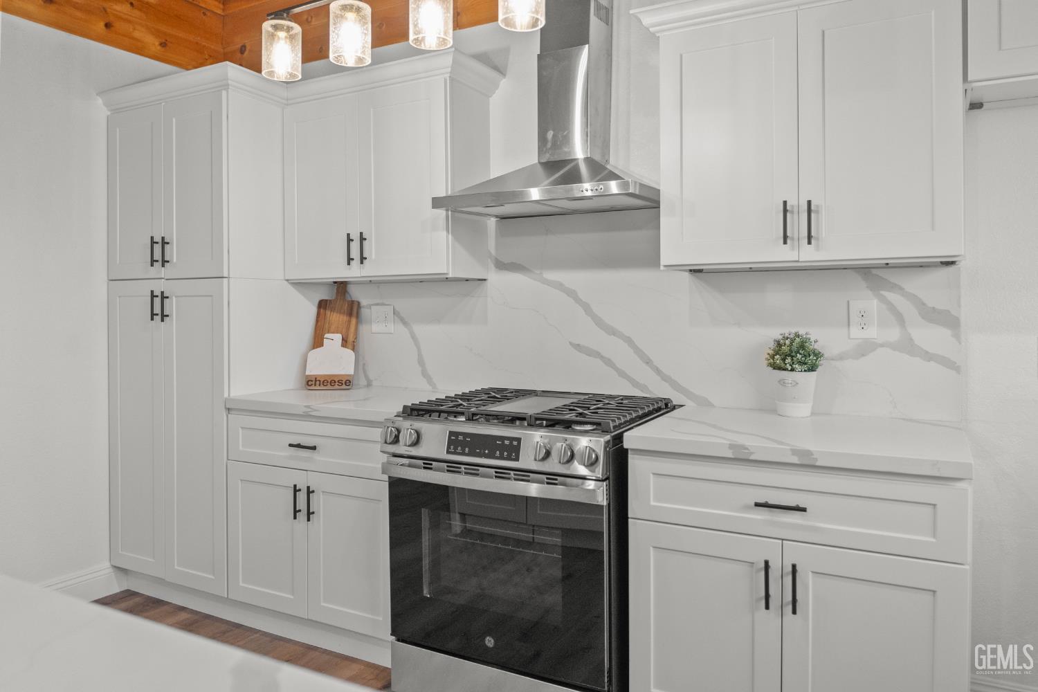 Undisclosed Address Tehachapi, CA 93561 - Photo 12 of 60 a kitchen with white cabinets and appliances