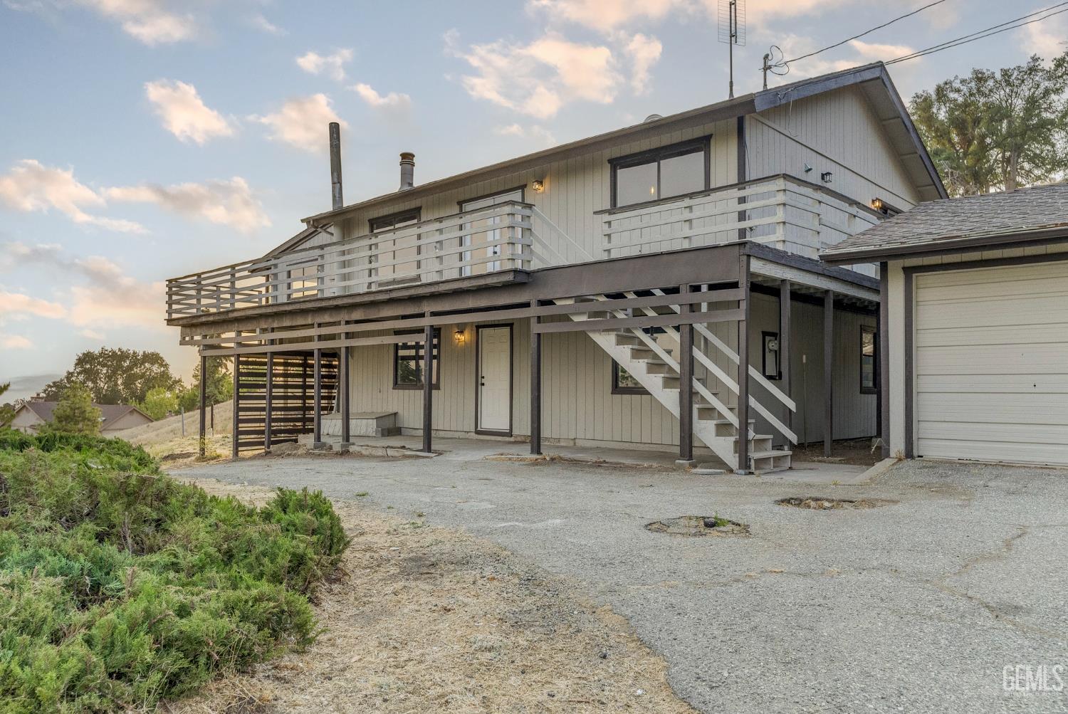 Undisclosed Address Tehachapi, CA 93561 - Photo 2 of 60 a view of a house with a large windows