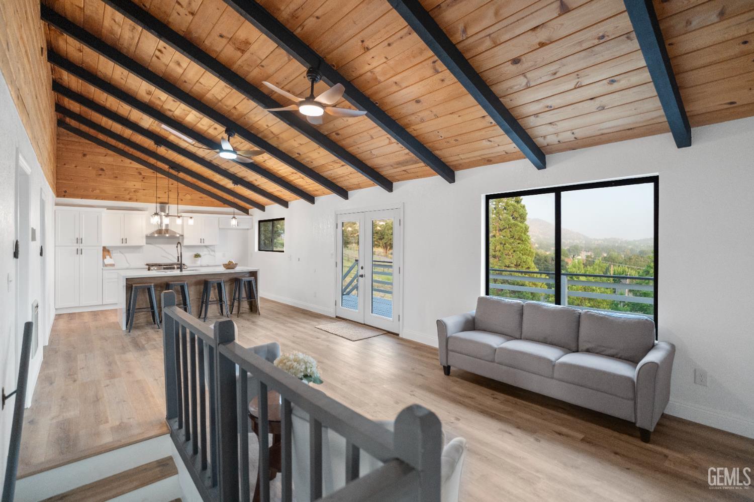 Undisclosed Address Tehachapi, CA 93561 - Photo 21 of 60 a living room with furniture and a floor to ceiling window