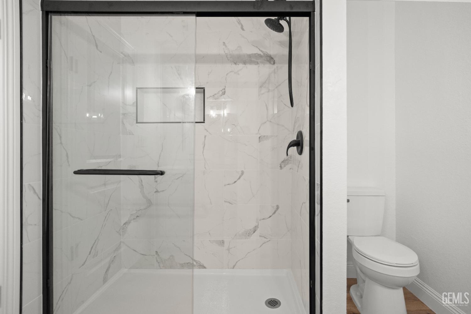 Undisclosed Address Tehachapi, CA 93561 - Photo 30 of 60 a bathroom with a shower and a toilet