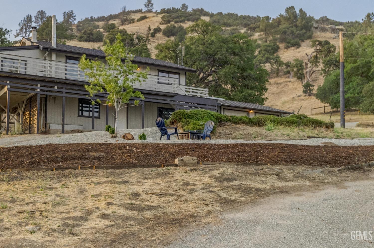 Undisclosed Address Tehachapi, CA 93561 - Photo 3 of 60 front view of a house with a yard