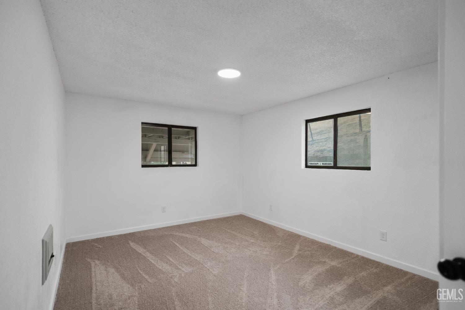 Undisclosed Address Tehachapi, CA 93561 - Photo 42 of 60 a view of a big room with closet and windows