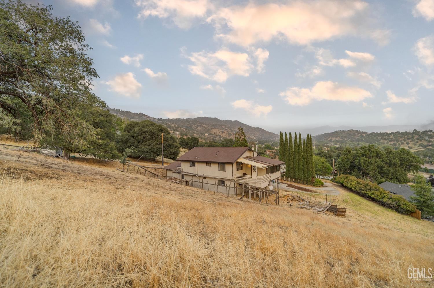 Undisclosed Address Tehachapi, CA 93561 - Photo 57 of 60 a view of a terrace with a garden and chair