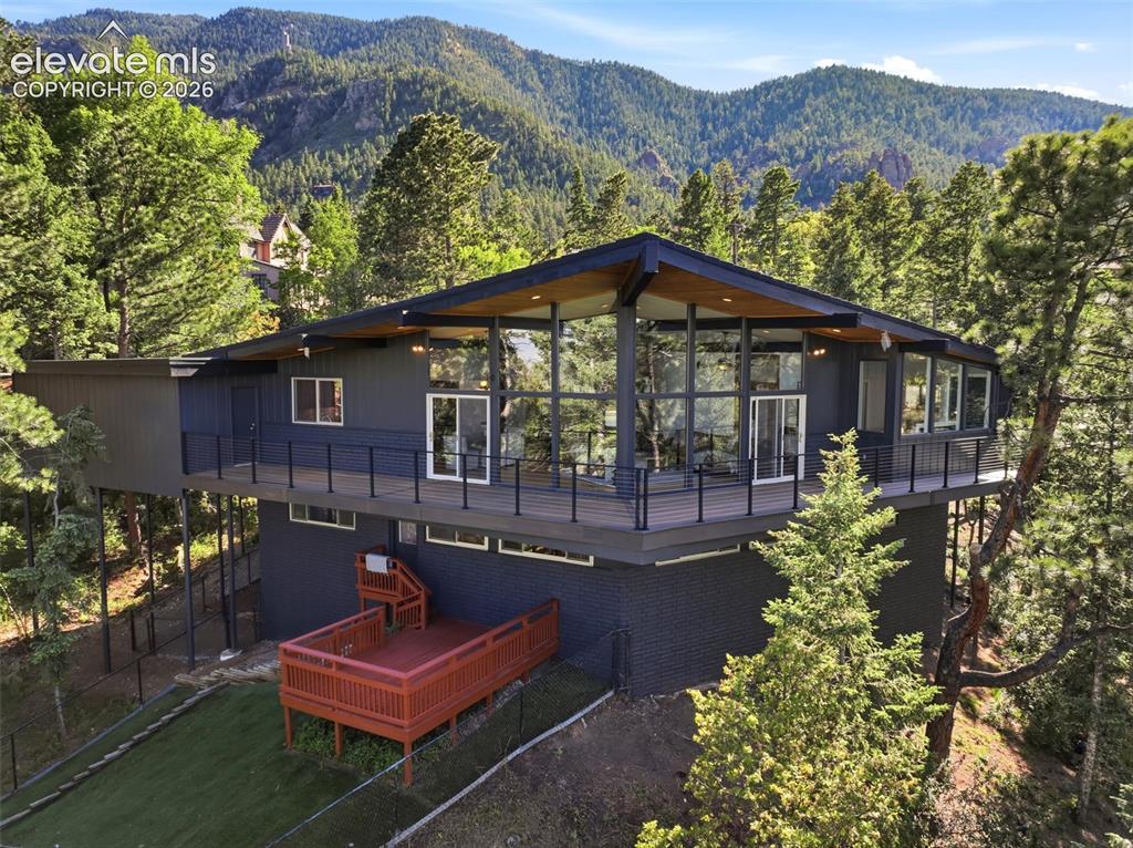 17 Pine Road Colorado Springs, CO 80906 - Photo 1 of 48 Tucked in the pines the back deck is dreamy