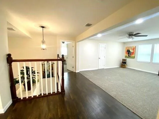 a front view of house with yard and trees around