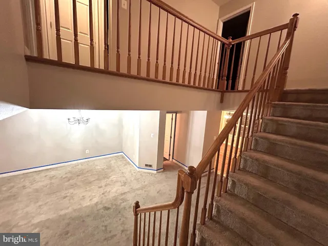 a view of staircase with wooden floor and stairs
