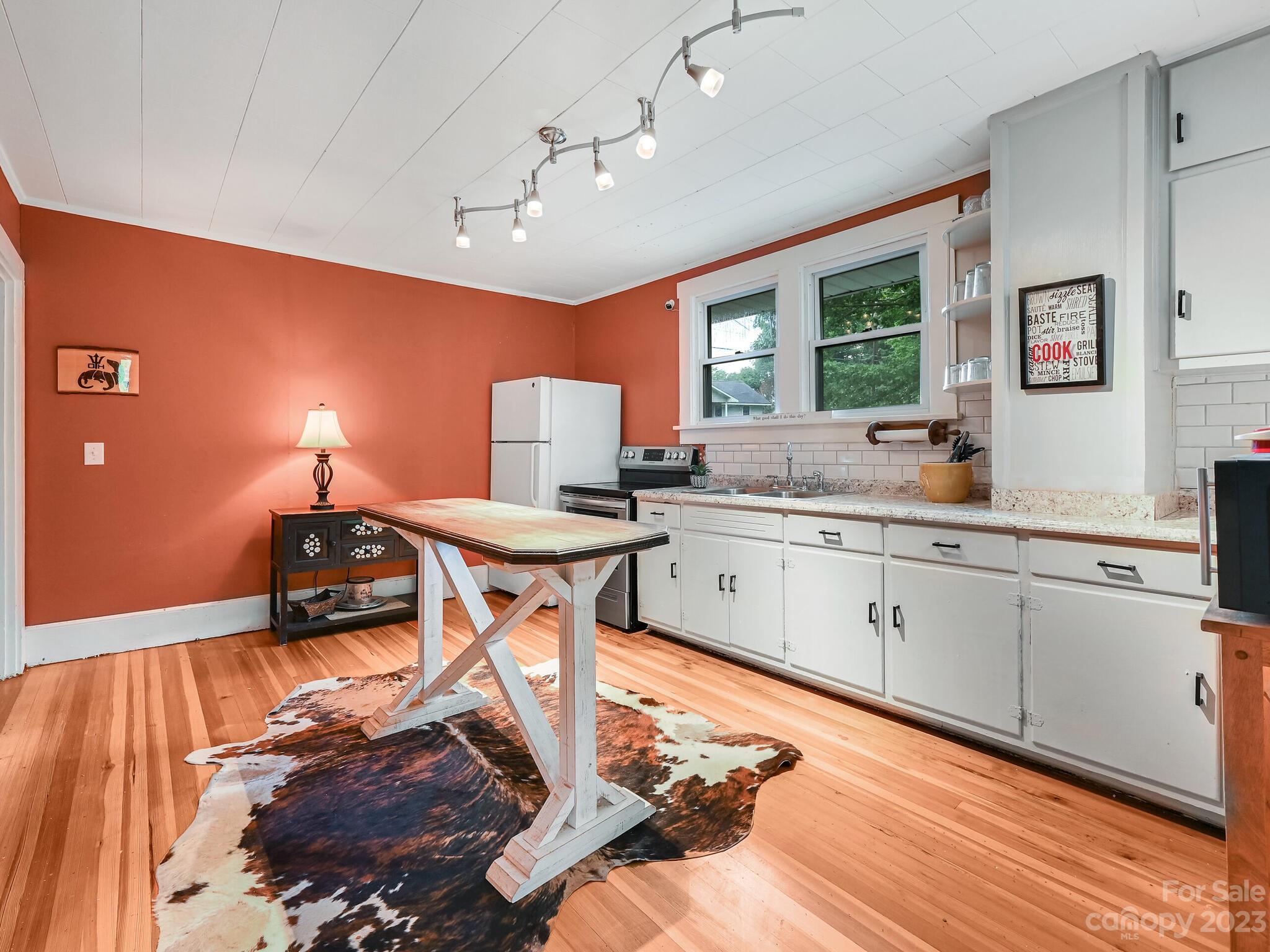 215 Erwin Hills Road Asheville, NC 28806 - Photo 11 of 32 a kitchen with a sink appliances and cabinets