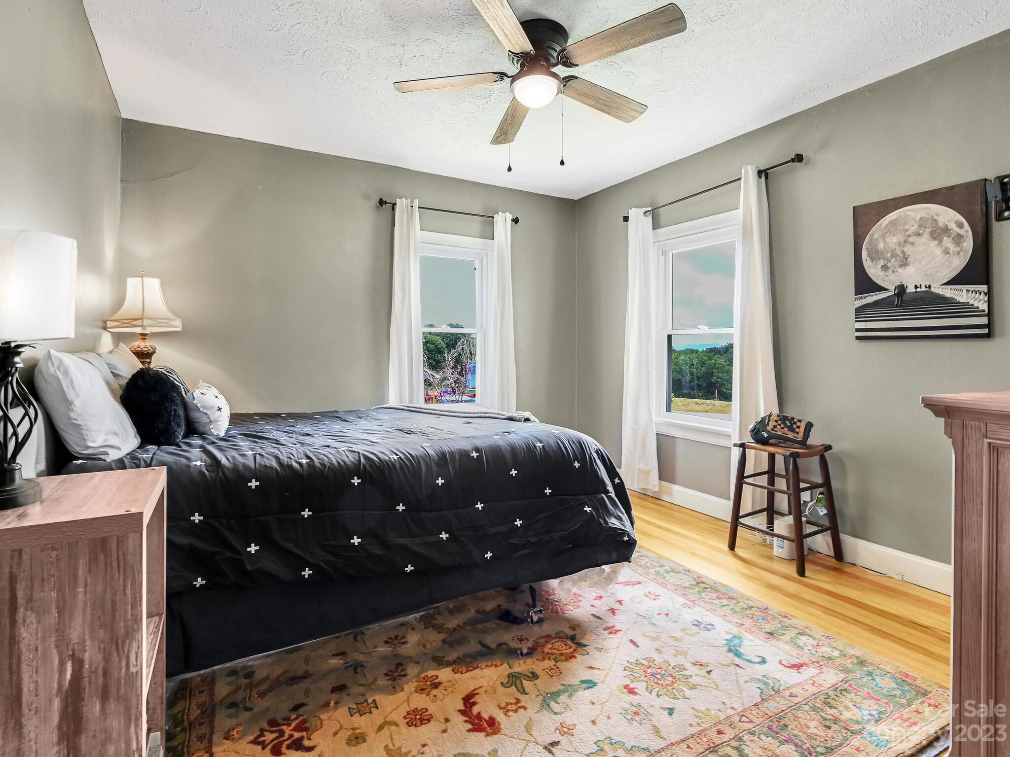 215 Erwin Hills Road Asheville, NC 28806 - Photo 13 of 32 a bedroom with a bed window and walk in closet