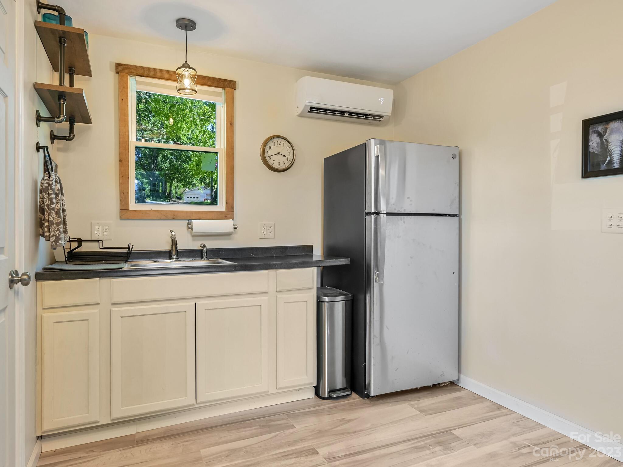 215 Erwin Hills Road Asheville, NC 28806 - Photo 20 of 32 a kitchen with a refrigerator and a sink
