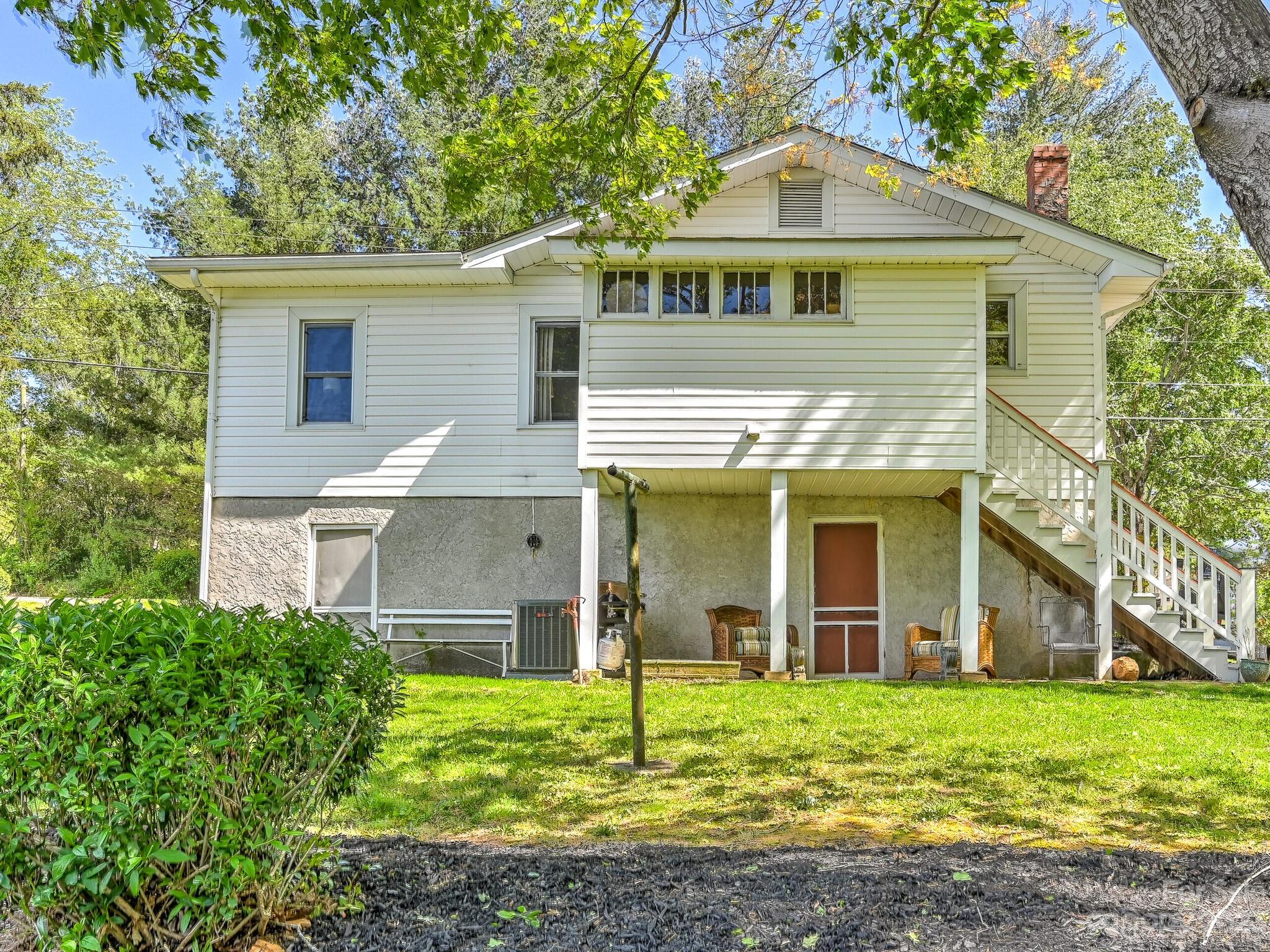 215 Erwin Hills Road Asheville, NC 28806 - Photo 2 of 32 front view of a house with a yard