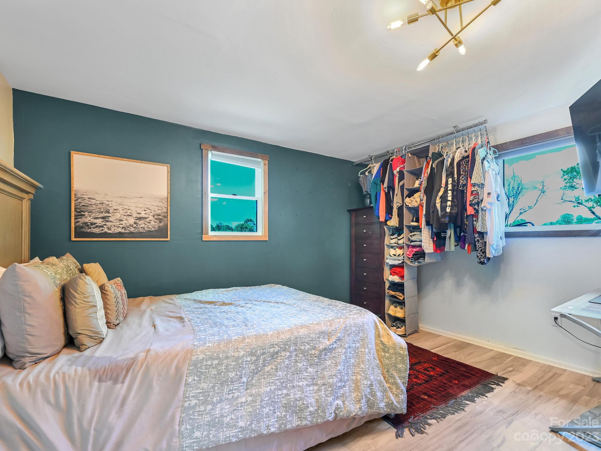 215 Erwin Hills Road Asheville, NC 28806 - Photo 22 of 32 a bedroom with a bed and a window