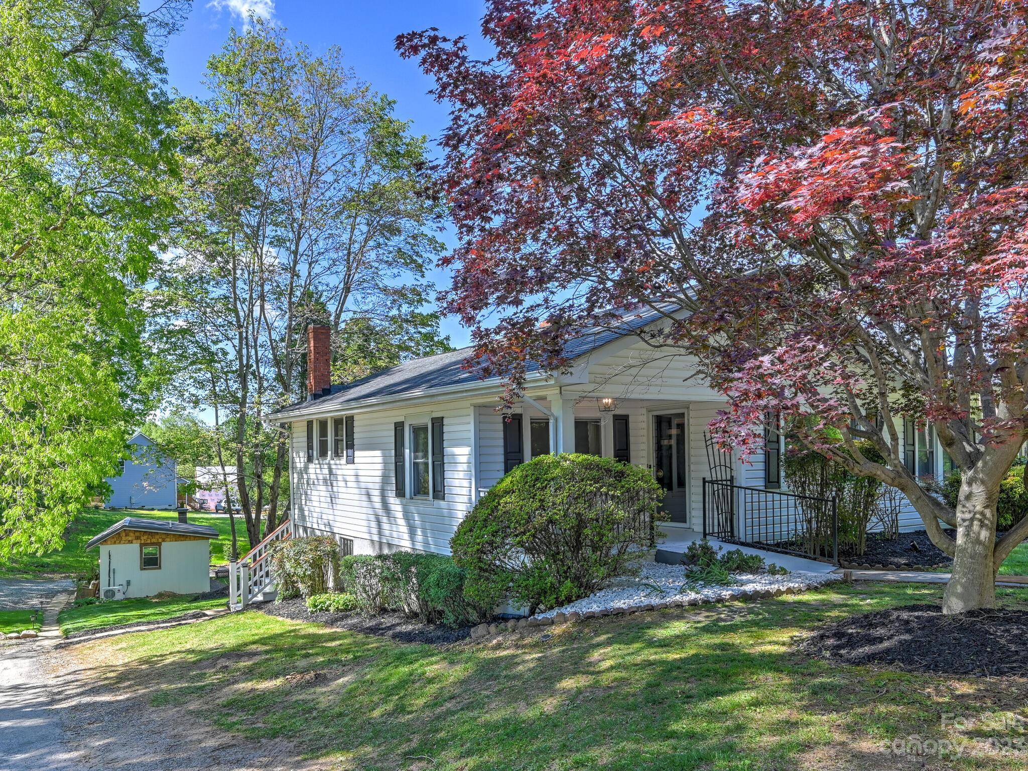 215 Erwin Hills Road Asheville, NC 28806 - Photo 24 of 32 a view of house with a big yard and large trees