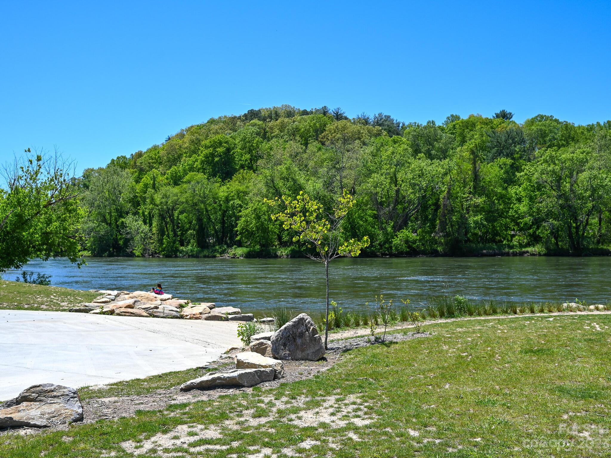 215 Erwin Hills Road Asheville, NC 28806 - Photo 28 of 32 a view of a lake with a yard