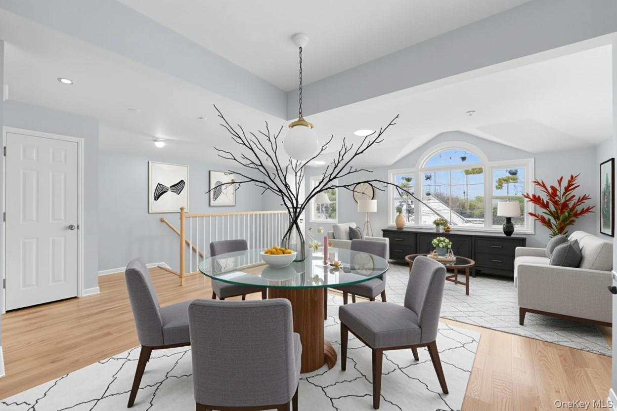 Dining area featuring light wood-style flooring and recessed lighting