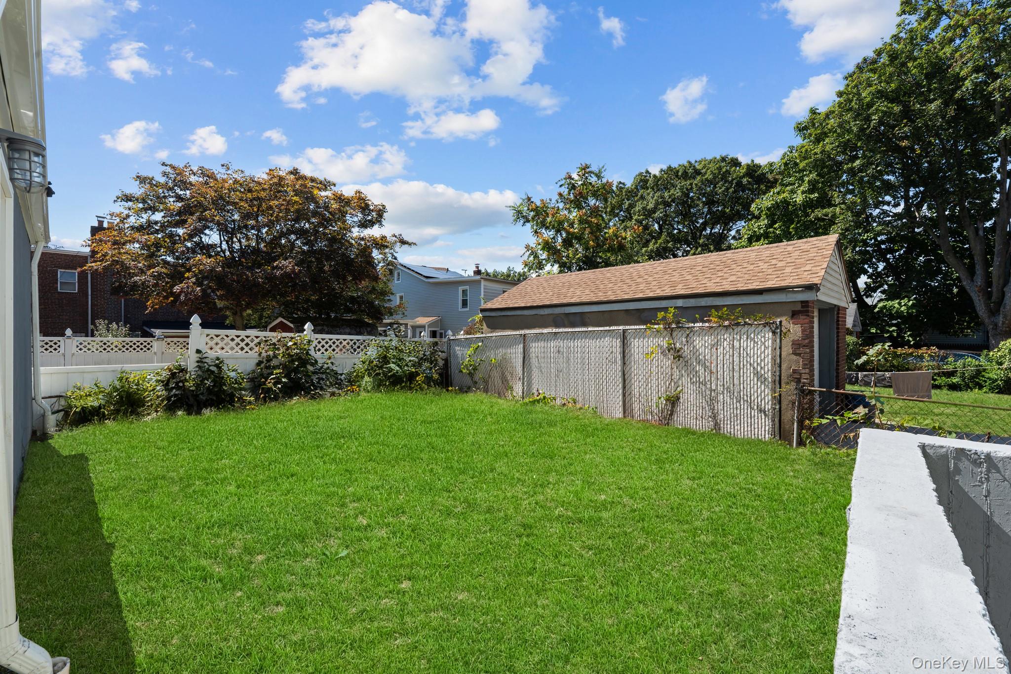 223-12 134th Road Queens, NY 11413 - Photo 13 of 17 View of fenced backyard