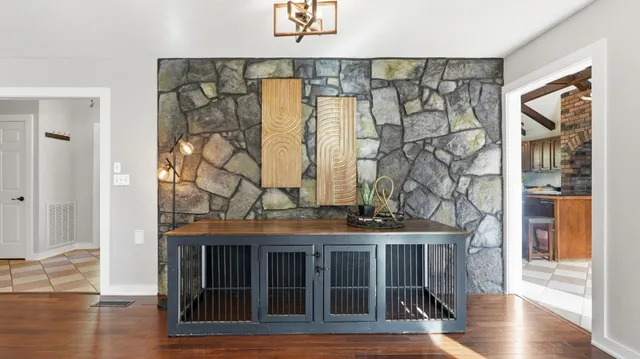 a bedroom with a bed and a dresser