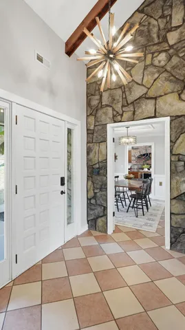 a kitchen with granite countertop a sink and a window
