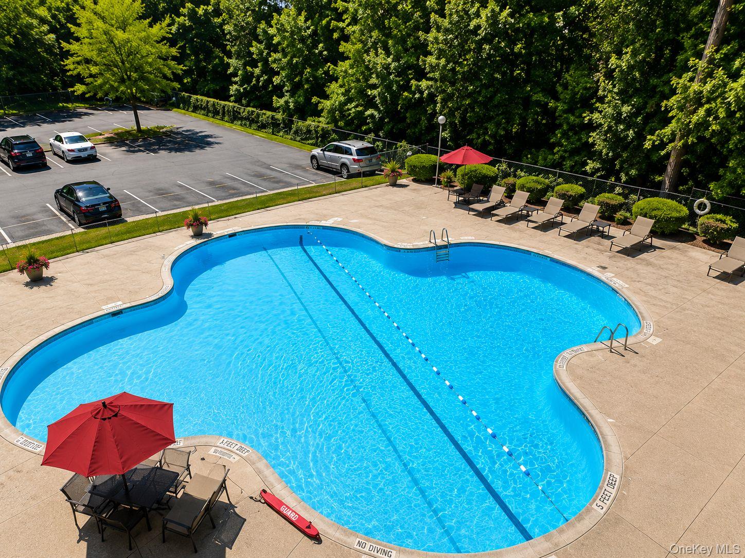 160 Academy Street, Unit 3J Poughkeepsie, NY 12601 - Photo 12 of 14 a view of a swimming pool with chairs