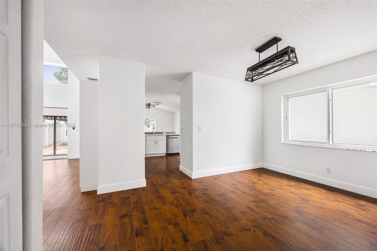 8317 Bermuda Sound Way Boynton Beach, FL 33436 - Photo 14 of 25 wooden floor in an empty room with a window