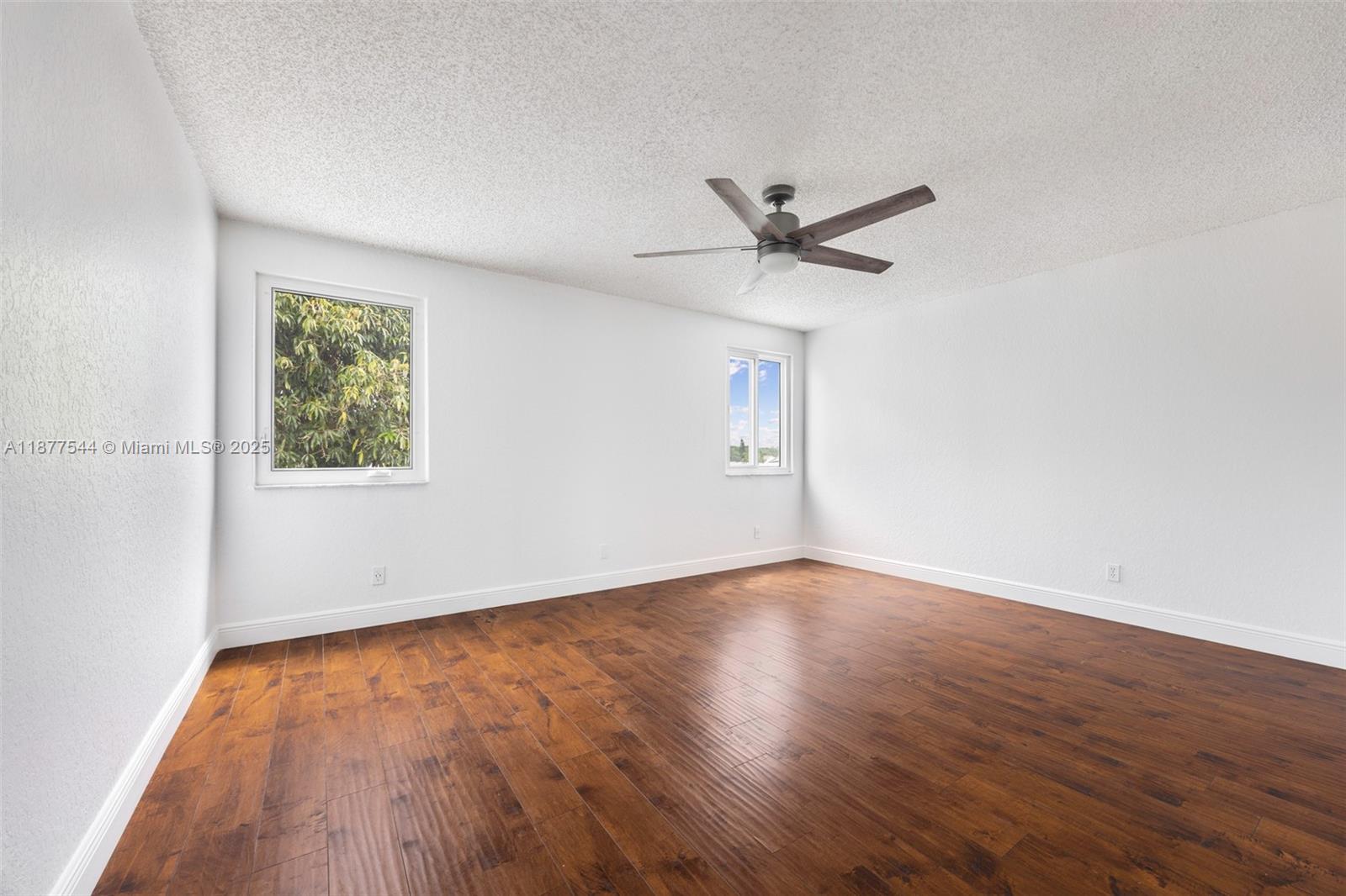 8317 Bermuda Sound Way Boynton Beach, FL 33436 - Photo 17 of 25 wooden floor in an empty room with a window