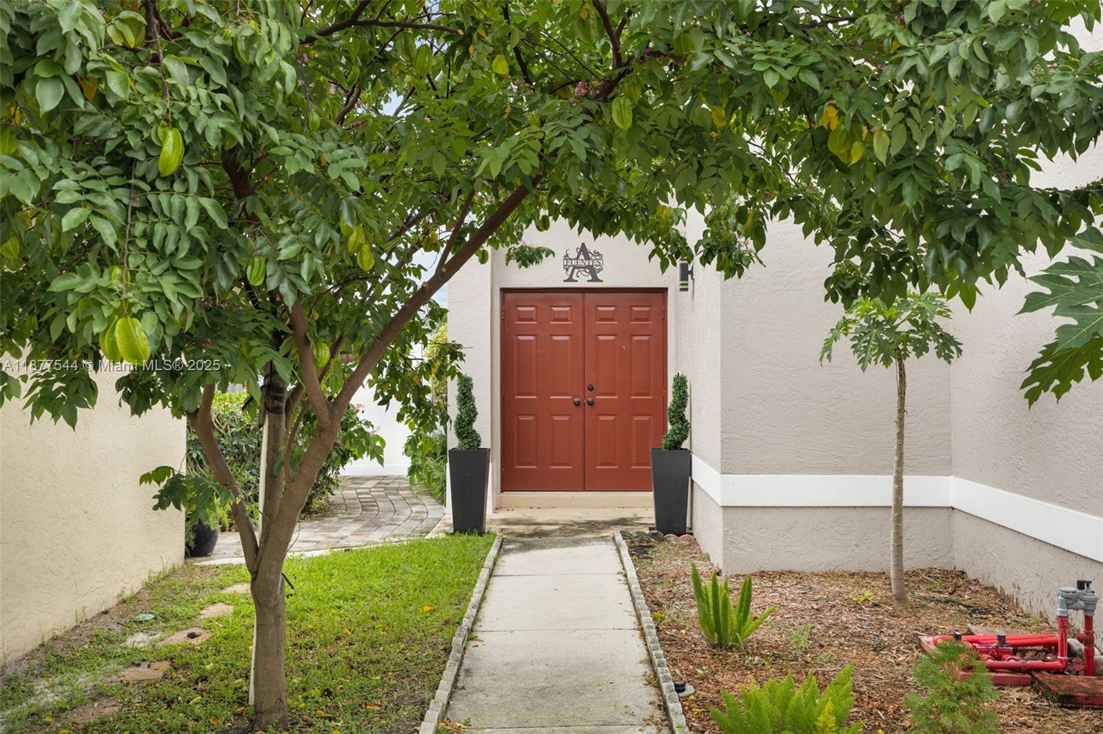 8317 Bermuda Sound Way Boynton Beach, FL 33436 - Photo 4 of 25 a front view of a house with garden