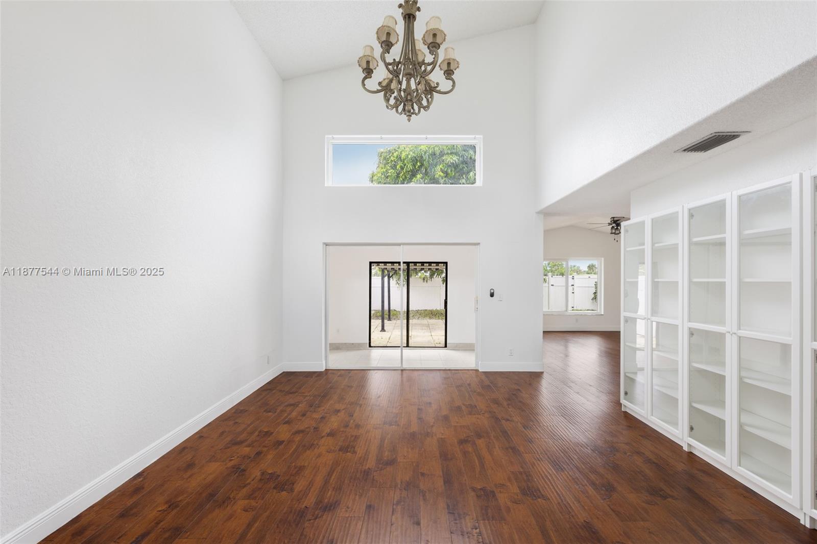 8317 Bermuda Sound Way Boynton Beach, FL 33436 - Photo 6 of 25 wooden floor in an empty room with a window