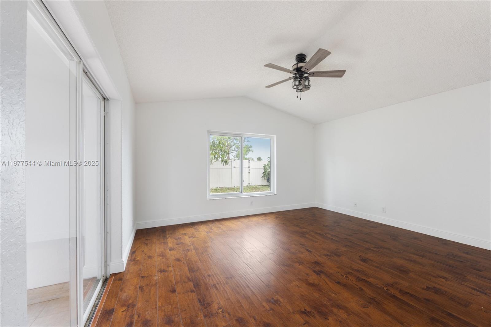 8317 Bermuda Sound Way Boynton Beach, FL 33436 - Photo 8 of 25 wooden floor in an empty room with a window