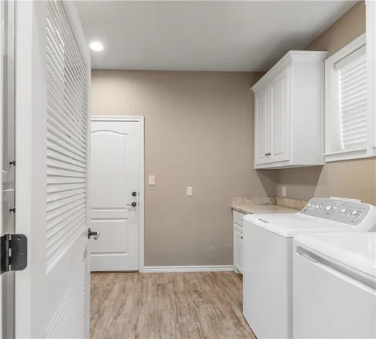 a view of cabinets with wooden floor